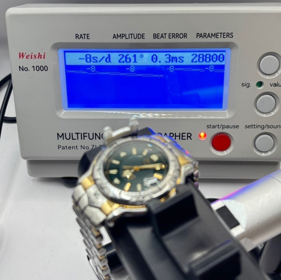 6980712